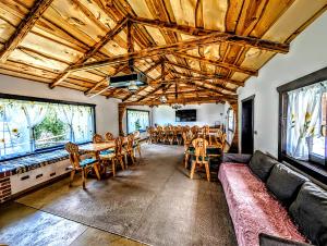 a dining room with a table and chairs at Casa Ghețu in Stulpicani