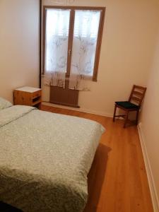 Ένα ή περισσότερα κρεβάτια σε δωμάτιο στο Appartement 3 chambres - 3 lits