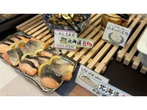 a display of sushi and other food in a store at Smile Hotel Sapporo Susukino Minami - Vacation STAY 60199v in Sapporo
