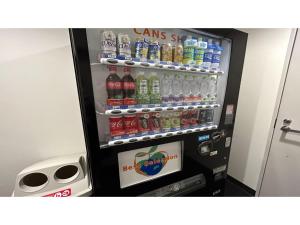 a vending machine with soda and sodas in it at Smile Hotel Sapporo Susukino Minami - Vacation STAY 60199v in Sapporo