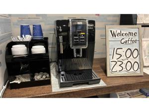 a coffee machine sitting on top of a counter at Smile Hotel Sapporo Susukino Minami - Vacation STAY 60224v in Sapporo