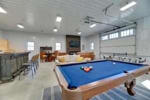 a garage with a pool table in a room at Spacious Canandaigua Group Getaway House and Barn! in Honeoye