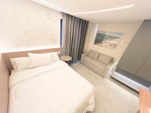Ένα ή περισσότερα κρεβάτια σε δωμάτιο στο Brooklin Design e Luxo - Próx Metro & Sh Morumbi
