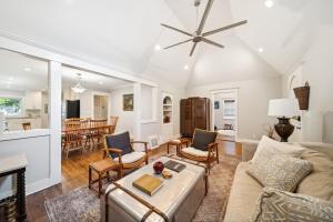 a living room with a couch and a table at 3 Bed, Office, Hot Tub, 2 Min To Cherry St in Tulsa