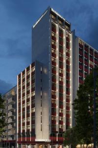 a tall building with a lot of windows at Residence Inn by Marriott Lisbon in Lisbon