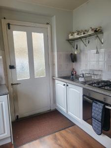 Η κουζίνα ή μικρή κουζίνα στο Quirky Central Bromley Apartment