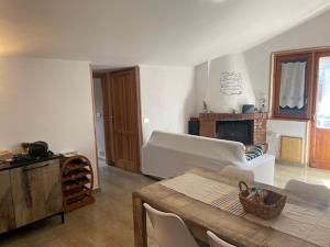 a living room with a white couch and a table at Attico da Luisa in Camigliatello Silano +45 photos