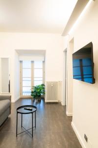 a living room with a couch and a table at Turin Central Carlo Felice in Turin