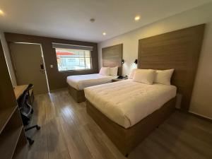 Postel nebo postele na pokoji v ubytování Comfort Inn Hermosillo Pitic