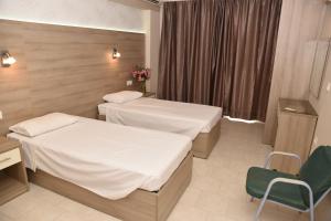 Posteľ alebo postele v izbe v ubytovaní Rose Hotel Faliraki