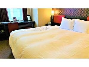 Katil atau katil-katil dalam bilik di Smile Hotel Nagoya Sakae - Vacation STAY 66736v +35 gambar