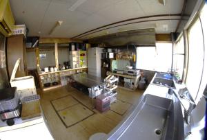 an overhead view of a kitchen with a tub in it at Minpakushisetsu Nipopo - Vacation STAY 19562 in Fukagawa +5 photos