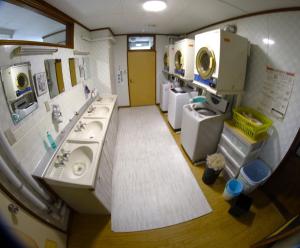 a large bathroom with two sinks and two sinksktop at Minpakushisetsu Nipopo - Vacation STAY 19564 in Fukagawa