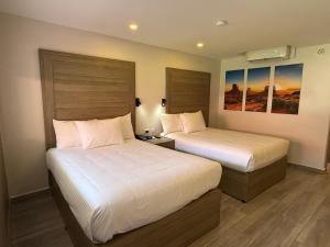 Postel nebo postele na pokoji v ubytování Comfort Inn Hermosillo Pitic