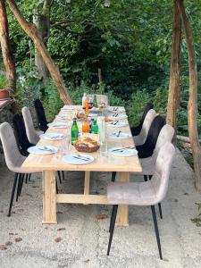 a long wooden table with chairs around it at Hagvi Resort in Alaverdi
