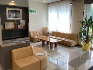 a living room with couches and a coffee table at Smile Hotel Yonezawa - Vacation STAY 67025v in Yonezawa
