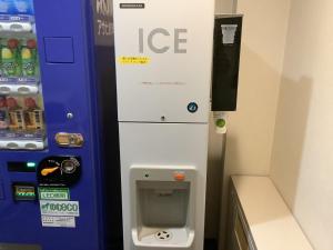 a ice machine in a room with a payphone at Smile Hotel Yonezawa - Vacation STAY 67001v in Yonezawa +10 photos