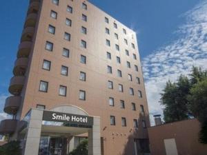 a large building with a smile hospital sign in front of it at Smile Hotel Yonezawa - Vacation STAY 67001v in Yonezawa
