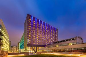 a building with blue lights on the side of it at Novotel London Paddington in London