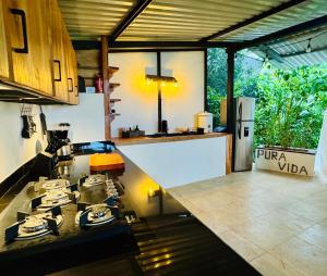 a kitchen with a stove and a counter top at Kayala Domes - Unique Luxury Domes in the Mountains - 4x4 recommended in La Ese