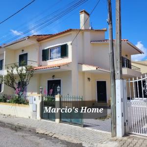 a house with a sign that reads maratos home at Marcio's Home in Fernao Ferro