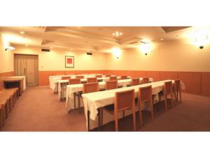 a large room with tables and chairs in it at Smile Hotel Tomakomai - Vacation STAY 68975v in Tomakomai