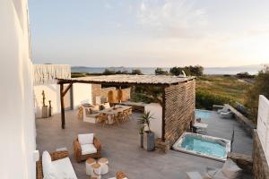 a view of a patio with a swimming pool at Villa Tranquilla - Beach House, Seaview, Pool & Jacuzzi in Plaka
