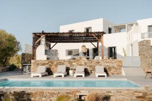 a villa with a swimming pool and a resort at Villa Tranquilla - Beach House, Seaview, Pool & Jacuzzi in Plaka