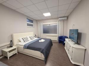 Ένα ή περισσότερα κρεβάτια σε δωμάτιο στο Apartmani EMA Bihać