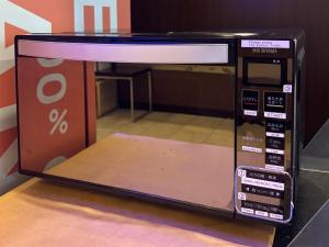 a microwave oven with its door open in a room at Smile Hotel Kyoto Shijo - Vacation STAY 69790v in Kyoto