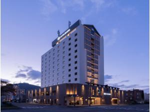 a tall white building with lights on top of it at HOTEL enoe Hakodate - Vacation STAY 78528v in Hakodate +10 photos