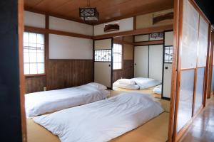 Ένα ή περισσότερα κρεβάτια σε δωμάτιο στο Japanese Villa Mihatacho - Vacation STAY 71709v