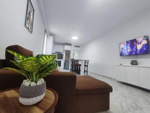 a living room with a couch and a table at Tus vacaciones Ideales en Costa Azul Isla de Margarita in Porlamar