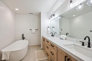 a bathroom with a large tub and a large mirror at Scenic Location, Sleeps 8, 5 min to Base & Bike Access, Private Hot Tub, Walk to restaurants! in Park City +19 photos