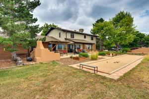 a house with a backyard with a basketball court at Mtn-View Home with Pickleball Court in Louisville! in Louisville