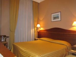 Postel nebo postele na pokoji v ubytování Hotel Conchiglia d'Oro