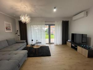 Posezení v ubytování La Mewa, Holiday House, Trzęsacz