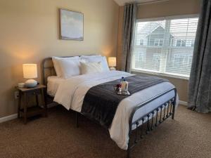 a bedroom with a bed with a tray on it at Retreat At The Charles Top Floor Gated Parking in Dublin