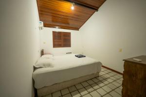 a bedroom with a bed in a room with a window at Chácara paraíso da Suzy in Recife +28 photos