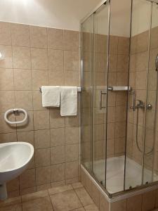 a bathroom with a shower and a sink at Apartments by the sea Vis - 1170 in Vis