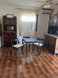 a dining room with a table and two chairs at Apartments by the sea Vis - 1170 in Vis