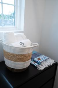 a basket of towels sitting on top of a table at 3BR Chic Ybor City Tampa Firepit Bikes in Tampa +39 photos