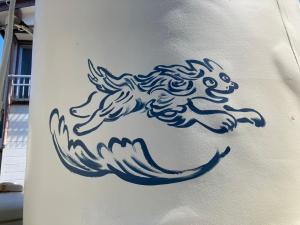 a drawing of a horse on the side of a building at Yado KONAMI in Shimoda