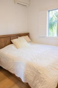 Ένα ή περισσότερα κρεβάτια σε δωμάτιο στο Beautiful Queenslander Getaway