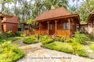 Zahrada ubytování Dani Beach Villa - Beachfront Villas in Penuktukan