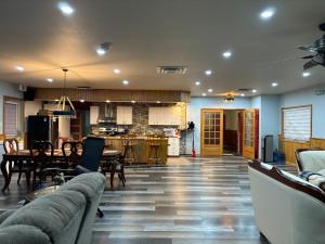 a kitchen and living room with a table and chairs at The Cozy Current in Bertrand
