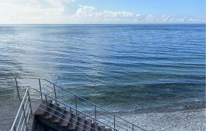 a staircase leading down to the ocean with a view at 4 Bedroom Lovely Home In Löttorp in Löttorp