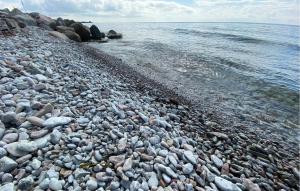a large group of rocks on a rocky beach at 4 Bedroom Lovely Home In Löttorp in Löttorp