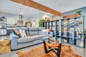 a living room with a couch and a glass table at Eva's Zen House Downtown ATL Retreat in Atlanta
