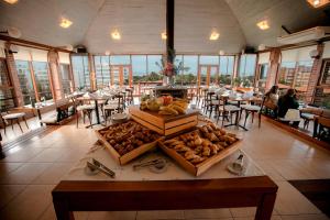 a table in a room with tables and chairs at Il Belvedere in Punta del Este